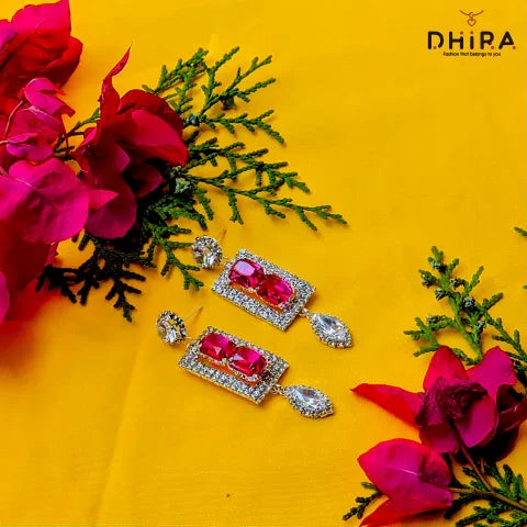 Elegant rectangular crystal pink earrings with diamonds on a yellow background, floral decor