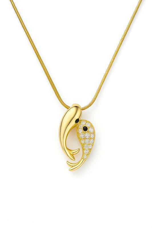 Gold dolphin pendant necklace with diamond accents on a gold chain, elegant jewelry design