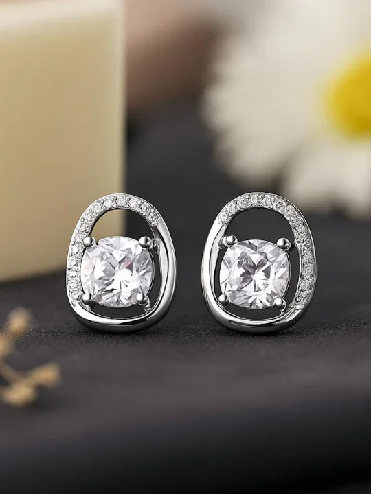 Elegant silver stud earrings with round clear stones and small accent crystals