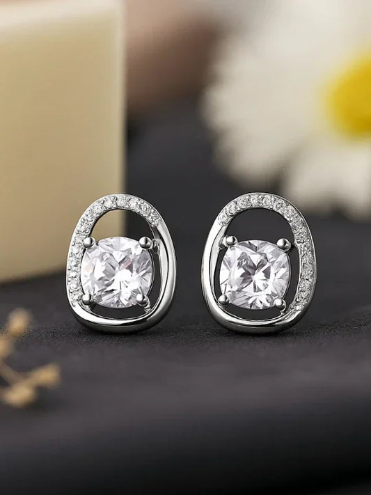 Elegant silver stud earrings with round clear stones and small accent crystals