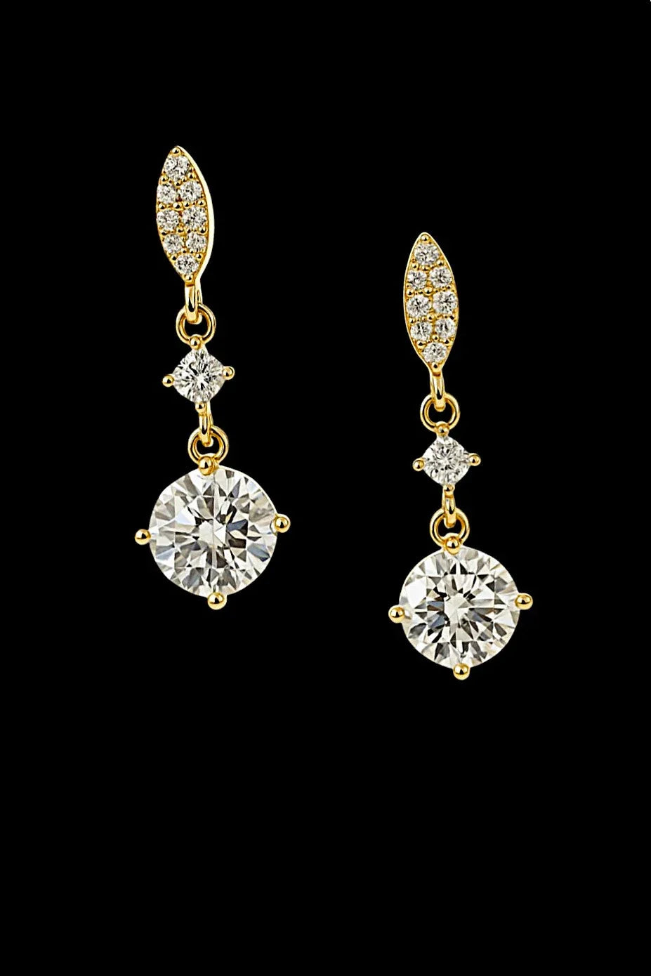 Gold drop earrings with sparkling round and marquise-cut stones on black background